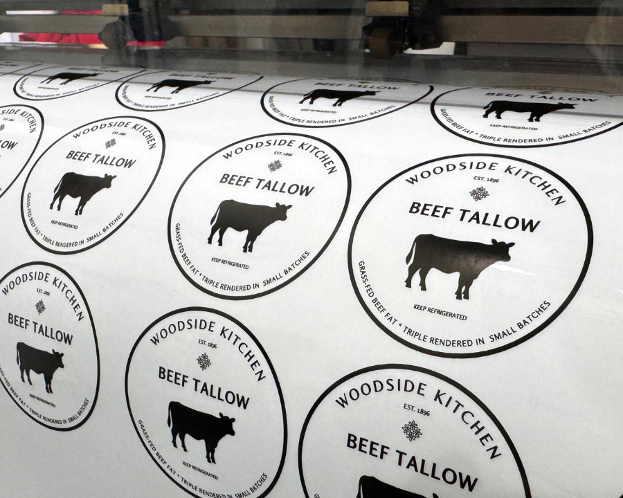 Round Woodside Kitchen Beef Tallow labels printed on a roll and cut on the plotter